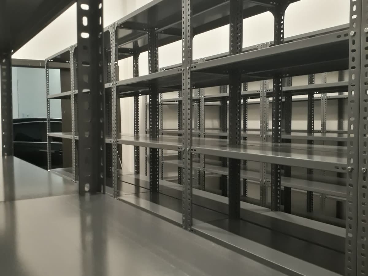 Steel shelving along the wall